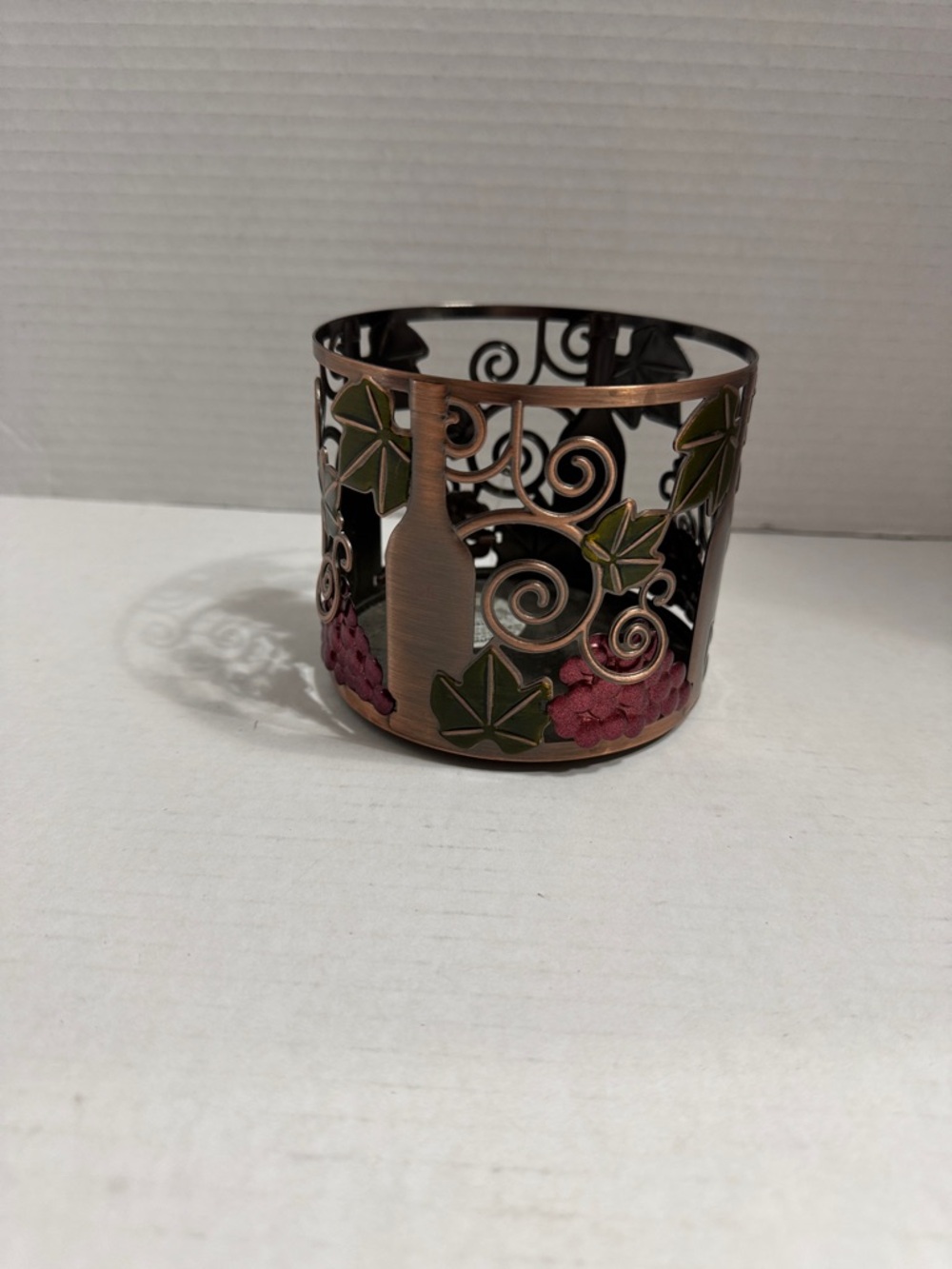 Copper-Finish Wine Bottle Candle Holder with Green Leaves and Pink Grapes